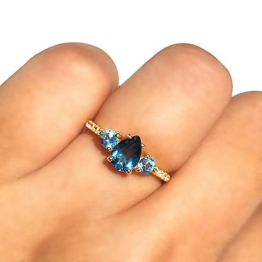 pear cut London blue and round cut Swiss blue topaz engagement and promise ring in 18k gold vermeil