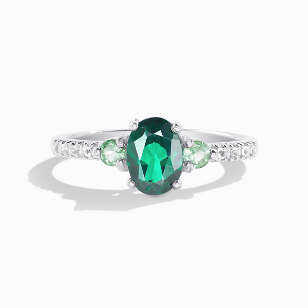 Oval cut green topaz and green tourmaline three stone engagement ring in sterling silver