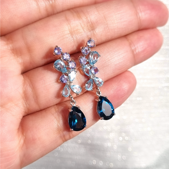 Pear cut london blue topaz and sky blue topaz and round cut tanzanite drop dangle earrings in sterling silver for evening wear