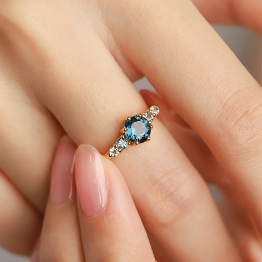 round cut ombre blue topaz five stone engagement ring with London blue Swiss blue and sky blue topaz in 18k gold vermeil