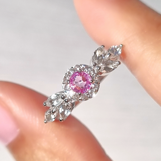 round cut pink sapphire halo ring with marquise wing white topaz in sterling silver