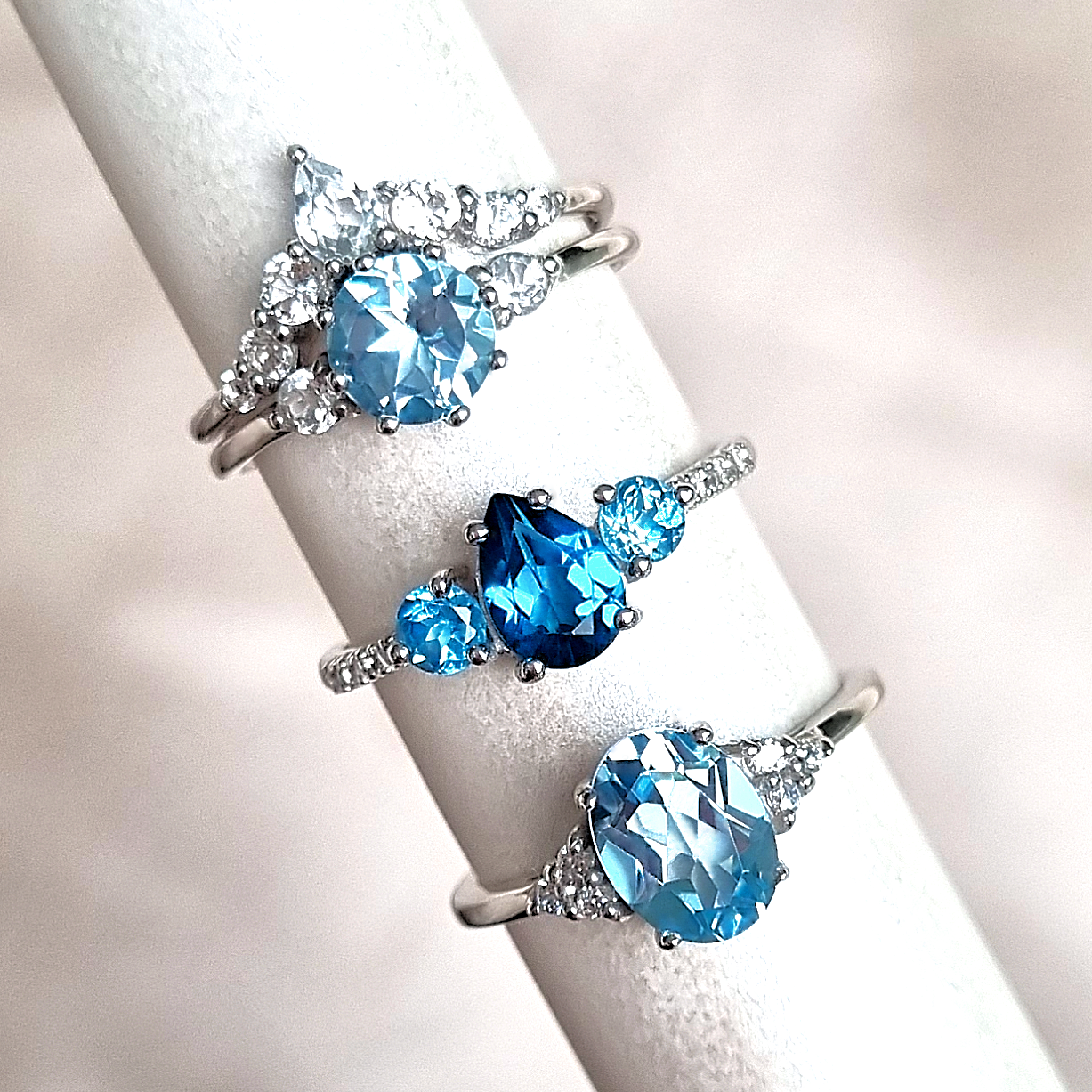 A group of blue gemstone rings including London blue, Swiss blue, sky blue topaz, white topaz engagement and wedding ring set in sterling sliver 