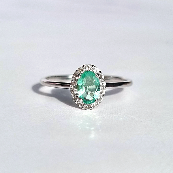 oval cut natural emerald and round cut diamond in sterling silver ,ideals for promise, engagement, and wedding ring.