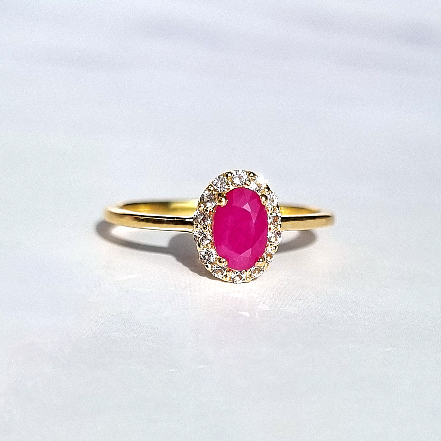  oval cut pinkish red gemstone and white topaz engagement , promise and wedding ring in 18k gold vermeil